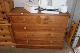 A modern pine chest fitted two short over three lo