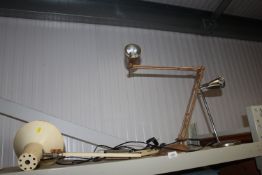 An Angle Poise style table lamp, another Angle Poise style lamp and a table lamp
