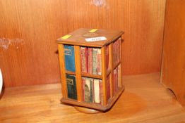 A miniature revolving bookcase and contents of various miniature Shakespeare books AF
