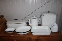 A collection of various enamelware including bread