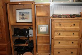 A modern pine open fronted bookcase fitted adjustable shelves
