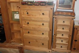 A modern pine chest fitted four long drawers