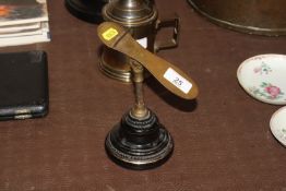 A Victorian brass adjustable stand on black and gi