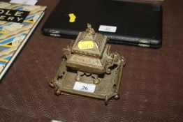 A small brass inkwell of Oriental design