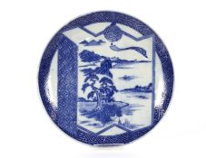 A Japanese scallop bordered plate decorated in the
