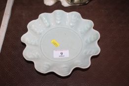 A celadon ground Studio pottery dish by Annie Hitc