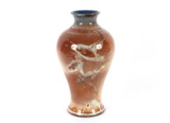 An unusual Royal Worcester pottery baluster vase having fish decoration on a ruby and blue mottled