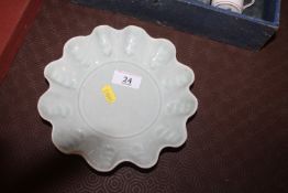 A celadon ground Studio pottery dish by Annie Hitc