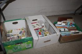 Three boxes of cigarette cards, postcards etc.