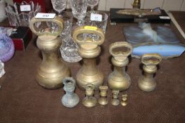 Nine brass bell weights