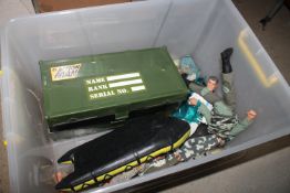 A box containing Action Man dolls and accessories