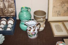 A Susie Cooper green glazed baluster jug; a smalle