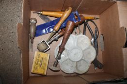 A small box of miscellaneous artists tools