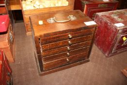 A Mah Jong set contained in a five drawer oak trav