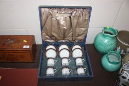 A cased set of six Crown Chelsea coffee cans and s