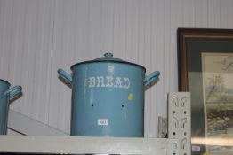 A blue enamel bread bin