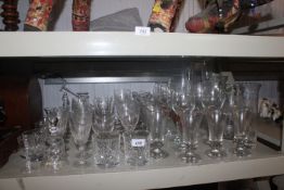 A collection of various table glass ware