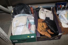Two boxes containing various handbags