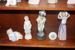 Three Lladro figurines together with a Nao ornamen