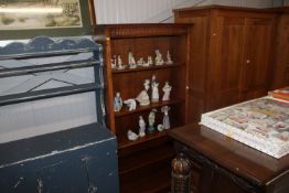 An oak open fronted bookcase with adjustable shelv