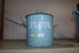A blue enamel flour bin