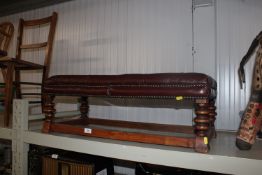 A leather upholstered and studwork decorated stool