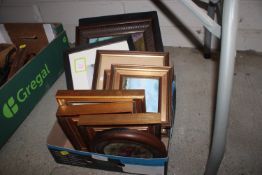 A box of various pictures and prints