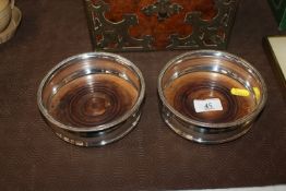 A pair of 19th Century Sheffield plated bottle coa