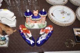 A pair of Staffordshire greyhound quill holders; a