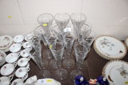 A collection of Hookes cut glass flutes