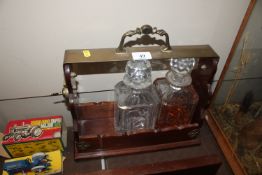 A mahogany and brass mounted locking two bottle Ta