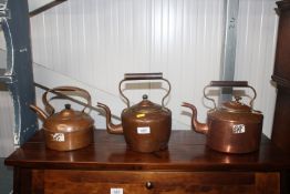 Three copper kettles