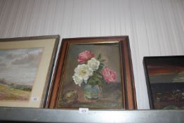 An oil on canvas still life study of flowers in a
