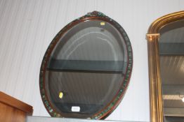 A Barbola style framed and bevel edged wall mirror
