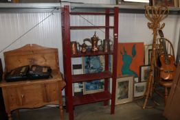 A red painted shelving unit