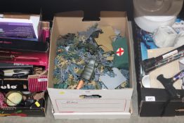 A box containing various model soldiers etc.