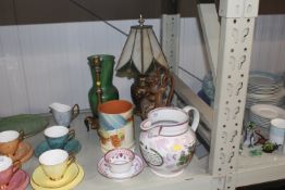 A table lamp having Tiffany style glass shade AF;