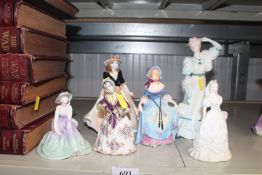 A collection of various figurines to include Coalp
