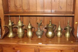 Seven Eastern brass coffee pots