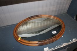 A cane framed wall mirror