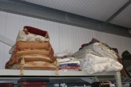A collection of various linen, fabric and cushions