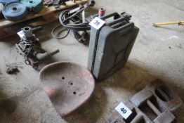 Tractor seat and Jerry can.