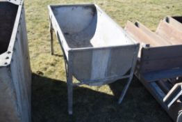 Galvanised milk bath.