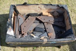 Box containing Kverneland plough parts.