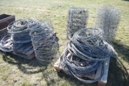 Various used straining wire and stock netting.