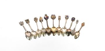A collection of various silver and white metal mostly enamelled souvenir spoons, approx. total