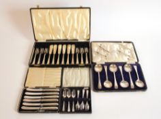 A cased set of six silver handled butter knives, a cased set of six each silver plated fish knives