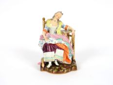 A Meissen porcelain figure, depicting a lady asleep her arm rested on a table, 19cm high
