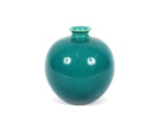 A Chinese green glazed baluster vase, of squat form, with scrolled black lacquer stand 20cm high