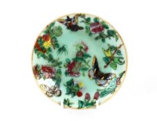 A small Chinese Canton saucer dish, decorated in the traditional palette, famille rose, butterflies,